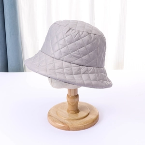 Detailed view of lightweight quilted bucket hat with grey rhombic diamond pattern