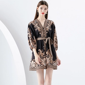 V-neck puff sleeve mini dress with gold vintage floral print on black fabric
