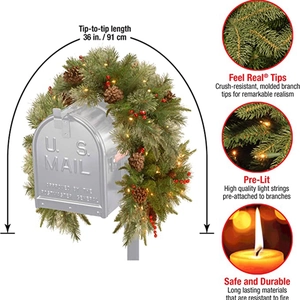 Detail view of 36-inch pre-lit Christmas mailbox swag with pinecones and red berries