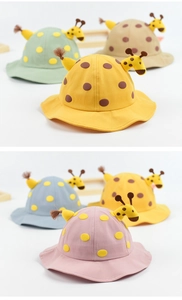 Detail of baby giraffe bucket hat with 3D ears and polka dots in multiple colors