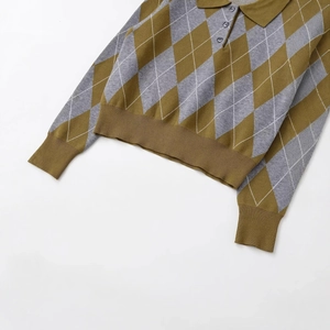 Short argyle knit polo shirt with olive green diamond pattern and ribbed cuffs