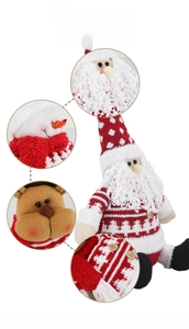 Detailed view of Christmas plush toys featuring knitted fabric textures and embroidery
