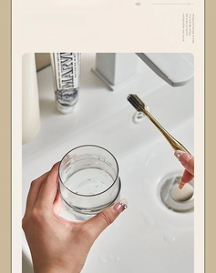 Detail of round smooth rim on portable travel toothbrush cup with minimalist clear design