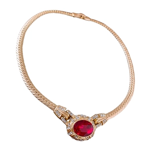 Vintage snake chain necklace with gold finish and red oval gemstone pendant