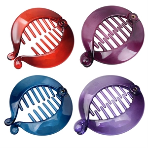 Set of four colorful banana clips in red, purple, blue, and lilac on white background