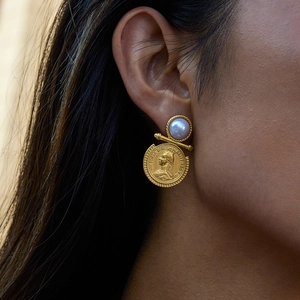 Detail of vintage coin earrings with grey pearls and Queen Victoria golden pendants
