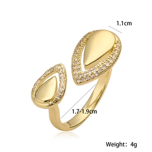 Adjustable 18K gold plated ring featuring asymmetric teardrop design with pavé crystals