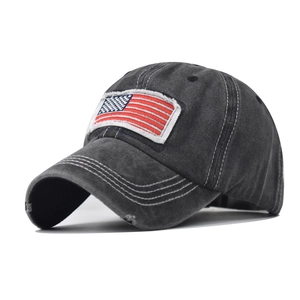 Detail of vintage washed grey ponytail baseball cap with American flag embroidery