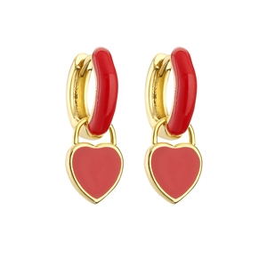 Detailed close-up of gold heart earrings with red enamel glaze and crystal accents