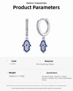 Macro detail of S925 sterling silver Hamsa Hand earrings with blue and white zircons