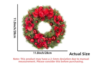 Detailed view of an 11-inch Christmas wreath with red flowers and bow on white background