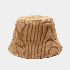Close-up of the ribbed corduroy fabric texture on the camel bucket hat detail