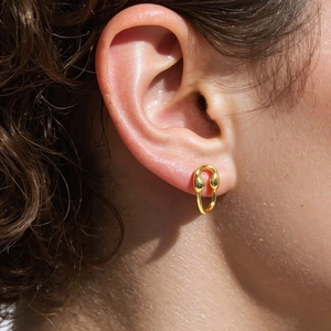 18K gold plated horseshoe buckle earrings with micro-set zircon on model