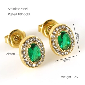 Macro view of double-layer stainless steel earrings with green zircon and 18K gold plating