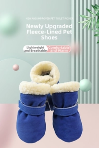 Detail of warm blue pet boots with soft fleece lining and secure velcro strap closure