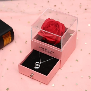 Pink jewelry gift box with red soap rose and silver heart necklace for Valentine's Day