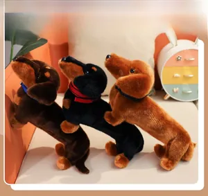 Three plush dachshund dog dolls in brown and black with colorful buckled collars