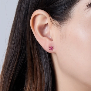 Detail view of 925 silver petal earring with marquise-cut pink zircon on a female model
