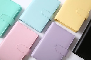 Flat lay of colorful A6 A5 PU leather macaron binders with secure magnetic buckle closure