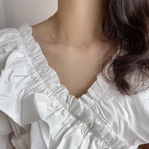 Minimalist 925 sterling silver olive bead choker necklace on female model