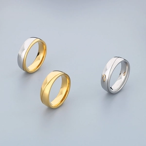 Polished 18K gold and silver stainless steel rings with minimalist layered curve design
