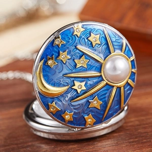 Quartz pocket watch featuring blue enamel cover with gold moon star motifs and pearl