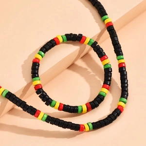 Ethnic style black wood bead necklace and bracelet set with red yellow green accents