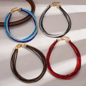 Bohemian multi-strand glass seed bead necklaces in blue, black, brown and red tones