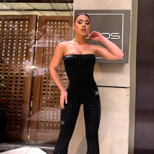 Sparkly sequin strapless jumpsuit for women in black with wide leg and slim waist