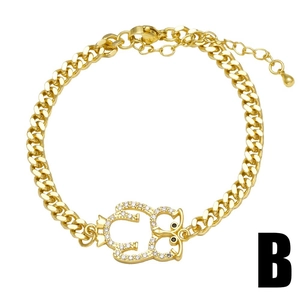 Golden cuban chain bracelet featuring a zircon owl pendant and lobster clasp closure