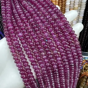 Detailed close-up of translucent purple natural stone abacus beads for DIY jewelry making