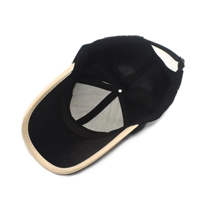 Detail view of the baseball cap's inner reinforced stitching and adjustable buckle