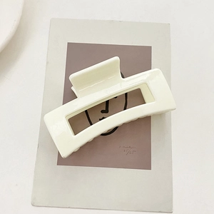 Minimalist cream white rectangular hollow hair claw clip made of smooth acrylic resin