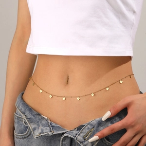Gold stainless steel waist chain with clover pendants on female model waist