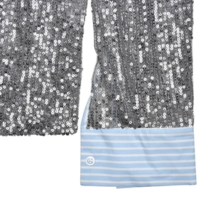 Detail of silver sequin shirt sleeve with light blue striped cuff and white button
