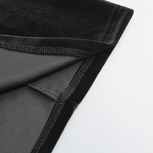 Detailed close-up of premium black velvet fabric texture with high-density stitching