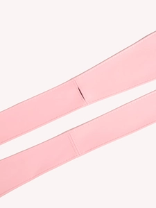 Detail of pink faux leather waist belt showing precise stitching and smooth texture