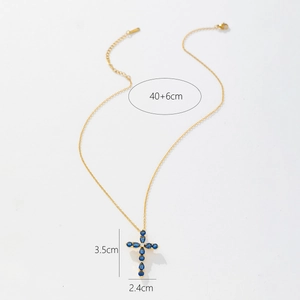 Detailed view of gold cross pendant with blue zircon stones and size specifications