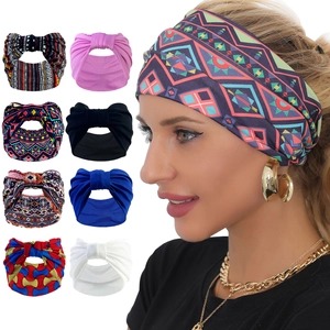 Detail of bohemian elastic headbands showing various ethnic prints and solid color styles