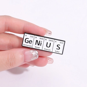 Handheld periodic table enamel pin spelling Genius with chemistry element symbols