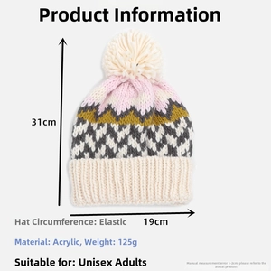 Detail view of wavy knit pattern beanie with pompom showing material and size specs