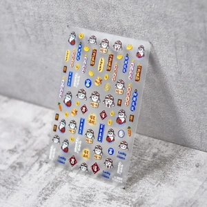 Detail of Lunar New Year nail art stickers with cute white rabbits and gold ingots
