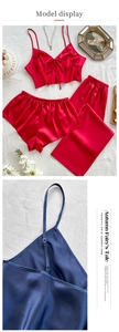 Detailed view of satin pajama set with adjustable straps and silk-like glossy finish