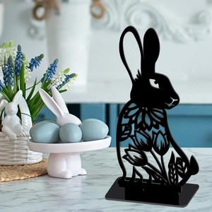 Close-up of black hollow Easter bunny acrylic tabletop ornament with home kitchen decor