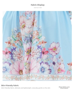 Gros plan sur le tissu en lin à imprimé floral avec détail de manche lanterne et fleurs
