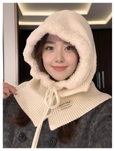 Detail of cream knitted balaclava hood with soft faux fur lining and drawstring