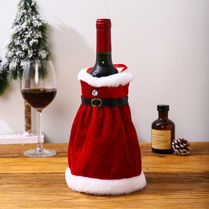 Detail of red velvet Christmas wine bottle dress with white fur trim and black belt