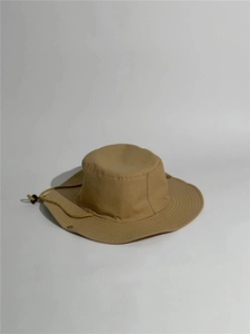 Detail view of khaki sun bucket hat with windproof drawstring and metal side snaps