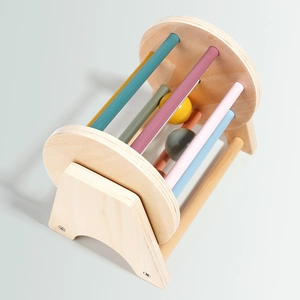 Montessori wooden spinning drum toy with colorful rods for infant sensory development
