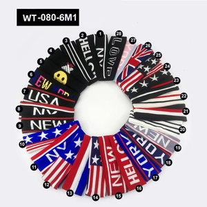 Selection of 28 elastic sports headbands featuring stripes, flags, and letter patterns